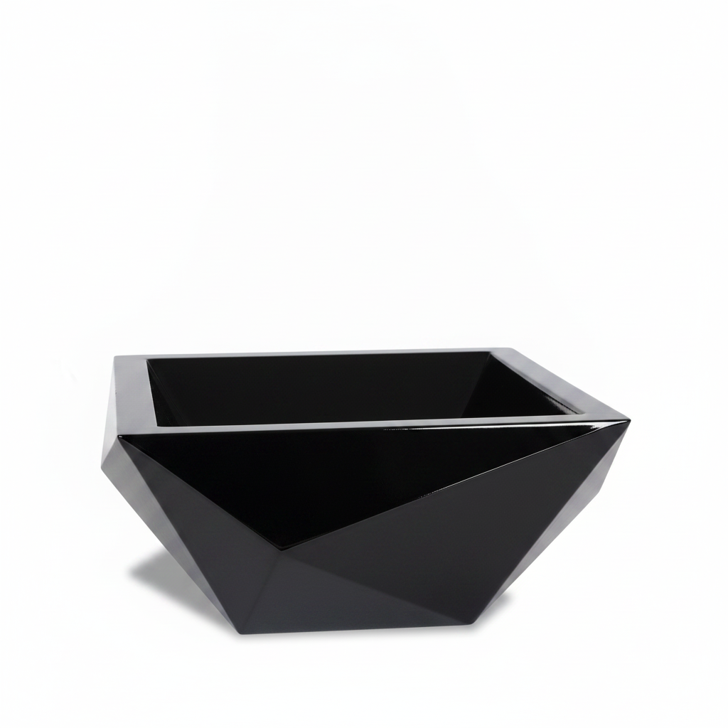 A modern, faceted rectangular planter in glossy black, photographed on a seamless white background.