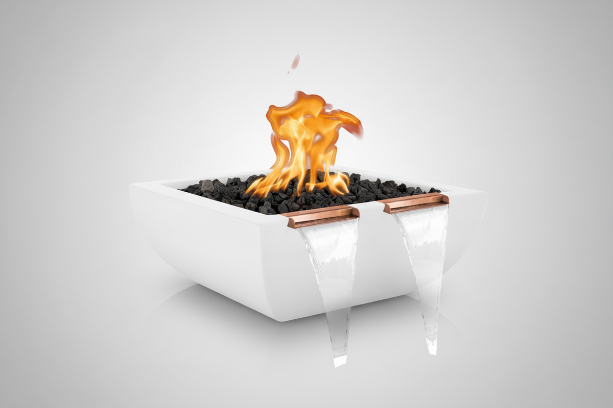 A modern white rectangular fire pit with black stones and a copper accent, shown with simulated flames and water cascades on a light gray background.