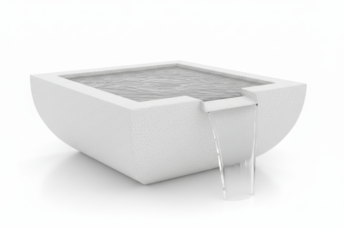 A modern square concrete water fountain with a textured light gray finish, featuring a clear glass waterfall spout and rippling water inside, shown on a seamless white background.