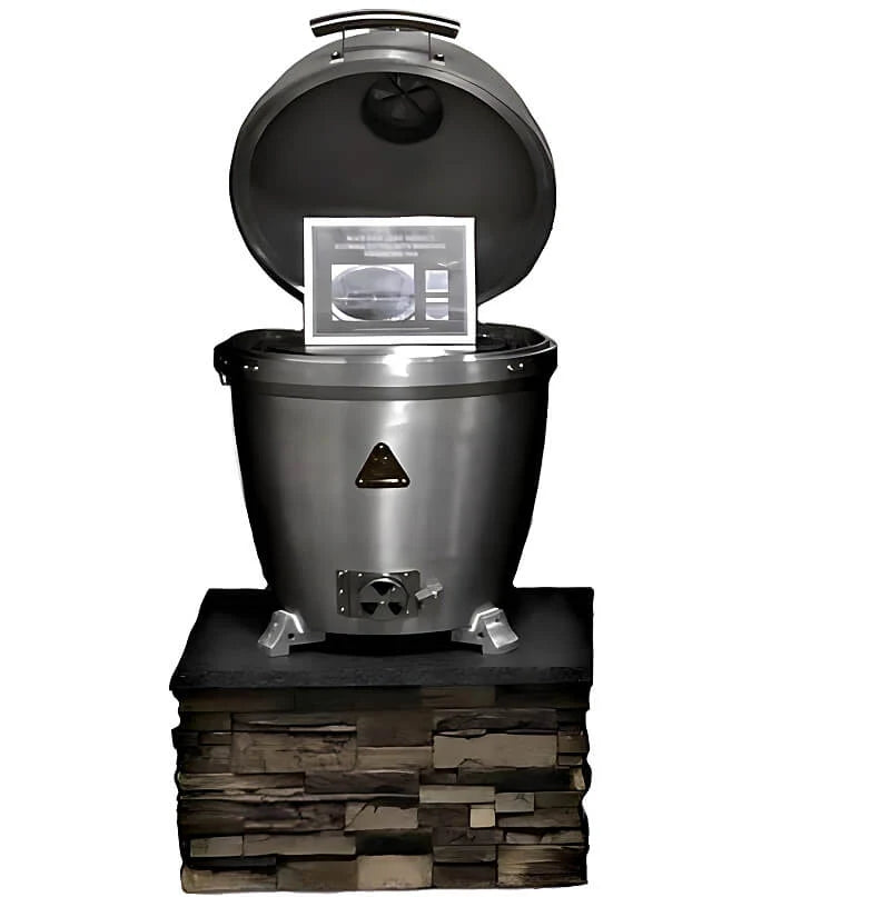 A stainless steel outdoor smoker or grill with its lid open, shown on a stacked stone base against a plain white background. A small instruction card is propped inside the lid.