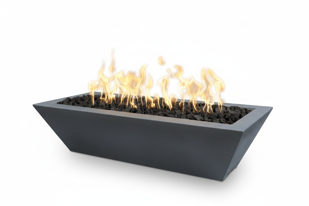 A modern rectangular fire pit with a dark charcoal gray concrete exterior, filled with black decorative stones and active orange and yellow flames, shown on a solid white background.