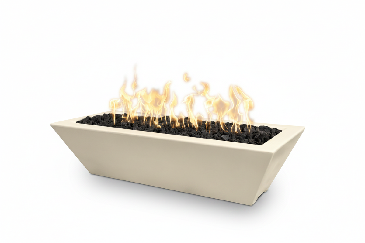 A rectangular outdoor fire pit with a cream-colored ceramic body, black decorative stones, and active orange and yellow flames, shown on a solid white background.