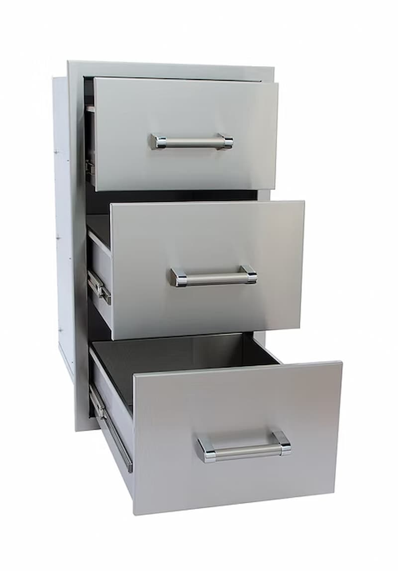 Stainless steel outdoor kitchen drawer unit with three drawers on a white background