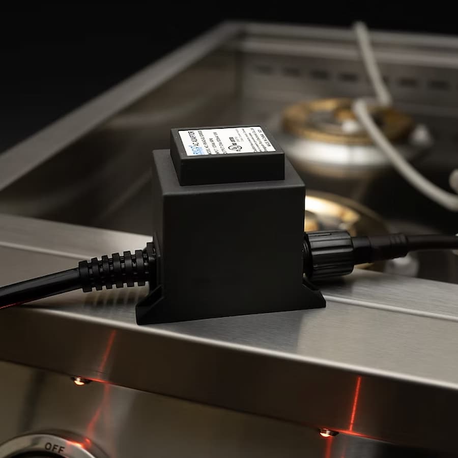 Black electronic component on a metallic surface with blurred background