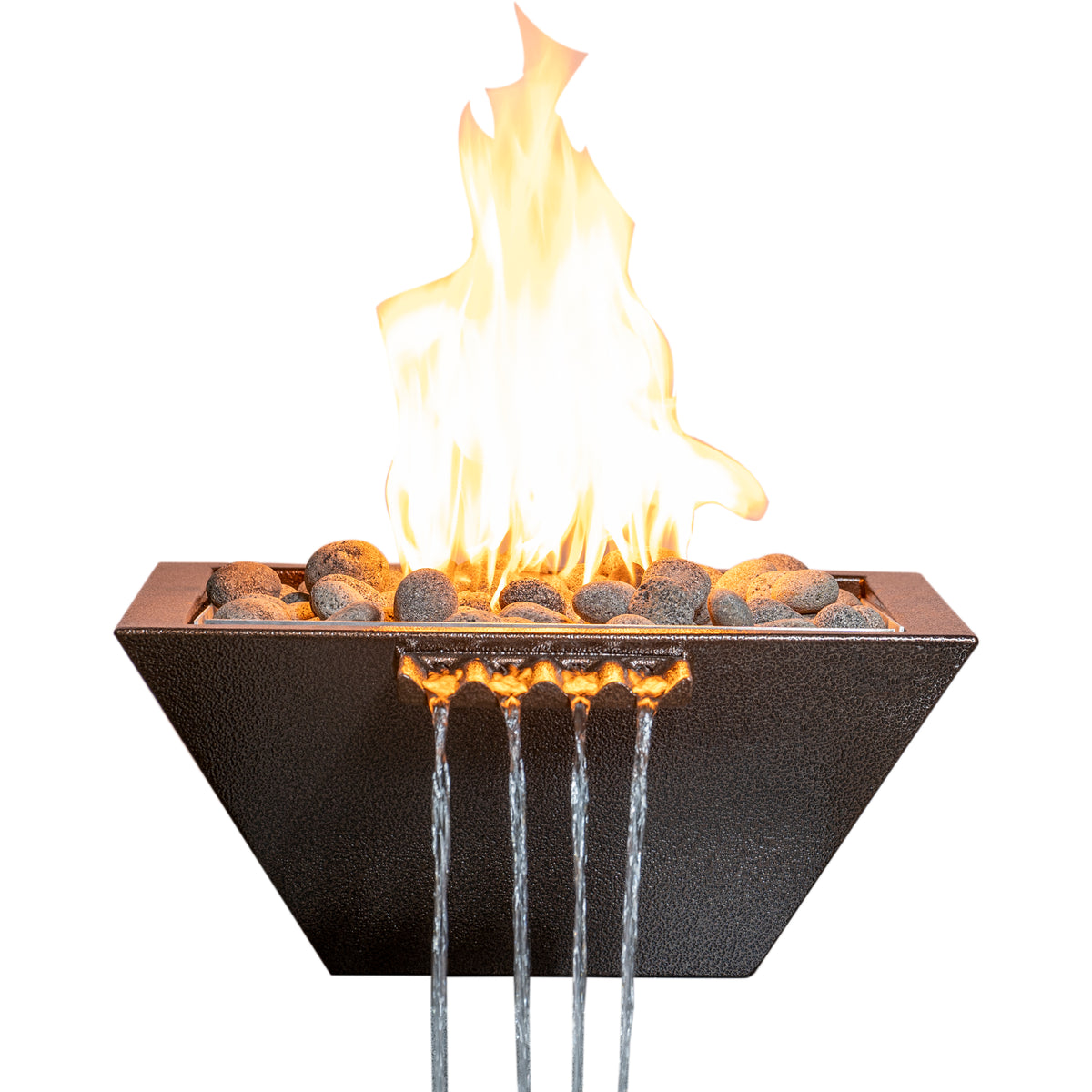 A modern square flame pit fire bowl with a textured dark charcoal exterior, filled with dark river rocks and active orange and yellow flames. Water cascades from the bottom edge in four clear streams against a solid white background.
