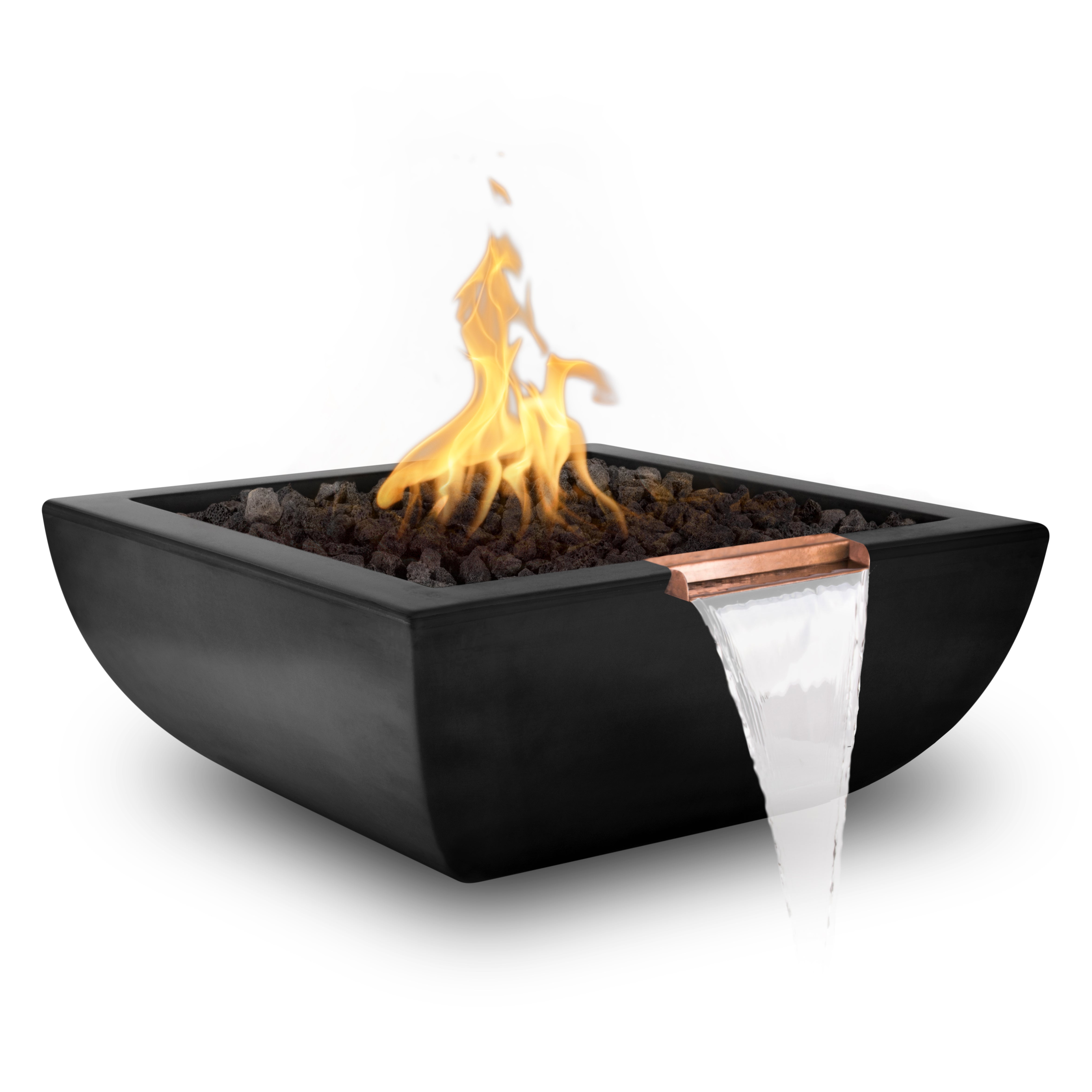 A square black fire pit bowl with a copper spout from which water cascades, filled with dark stones and lit with a bright yellow-orange flame, on a white background.