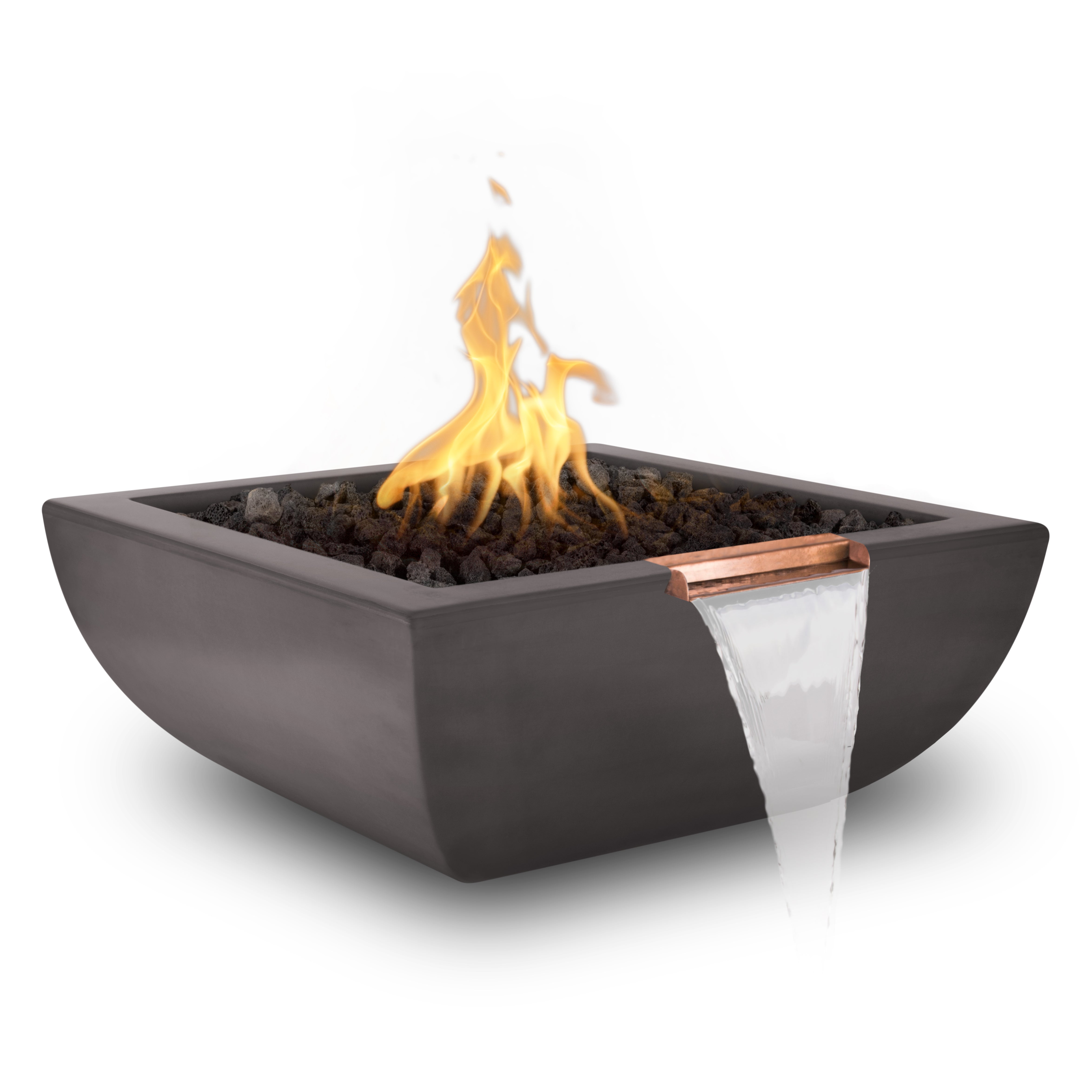 A square dark charcoal fire pit bowl filled with black stones and active orange-yellow flames, featuring a copper-colored trim and a white waterfall spout on a clean white background.