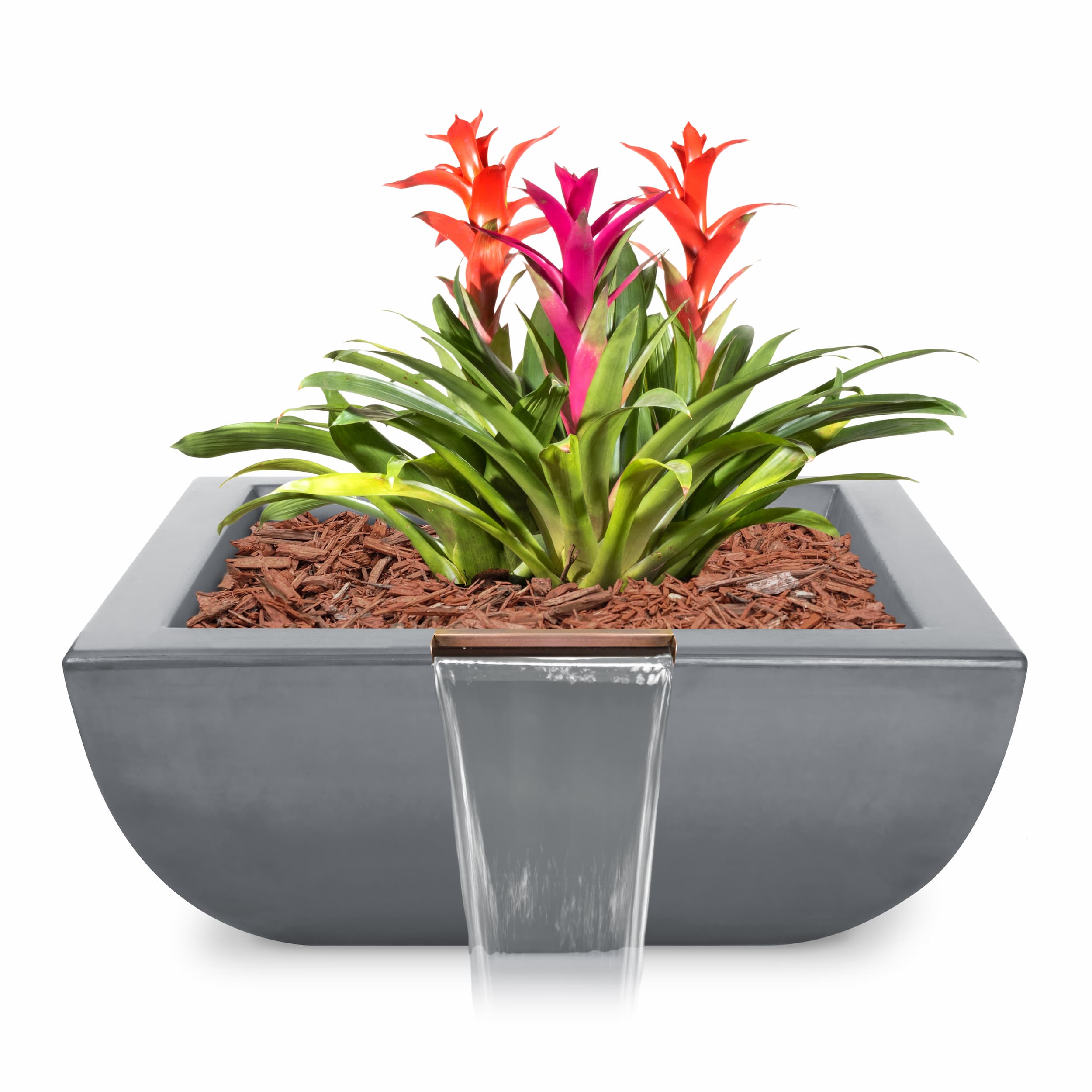 A modern gray rectangular planter with a small waterfall feature in front, filled with brown wood chips and a vibrant green and pink bromeliad plant, shown on a white background.