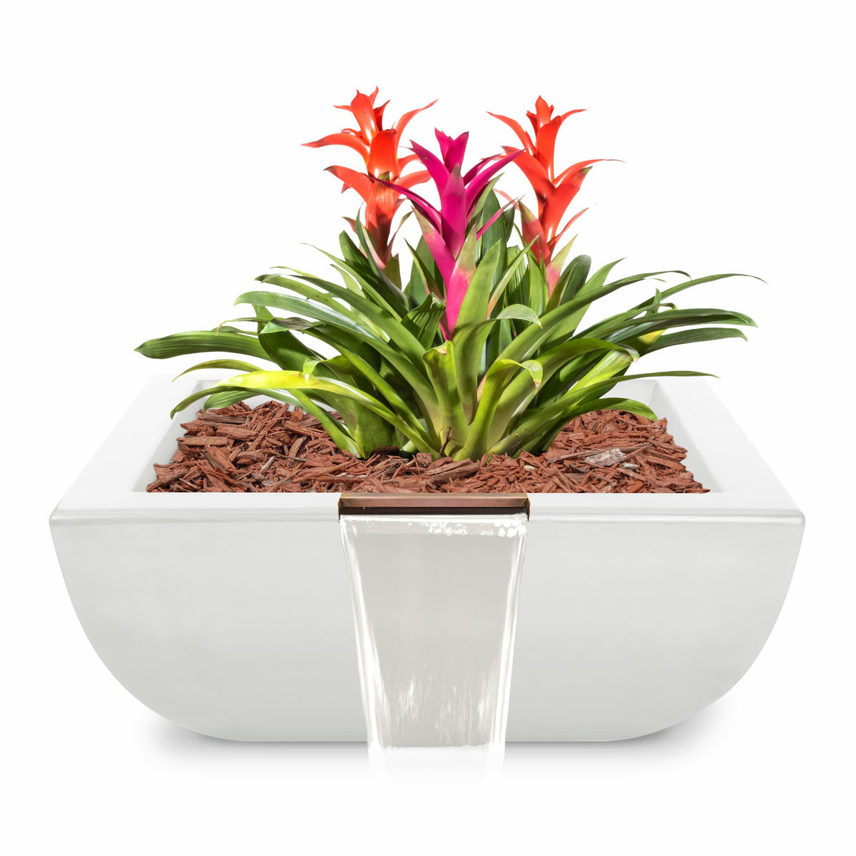 A modern white rectangular planter with a small waterfall feature, filled with brown wood chips and a green bromeliad plant with bright red and pink flowers, shown on a white background.