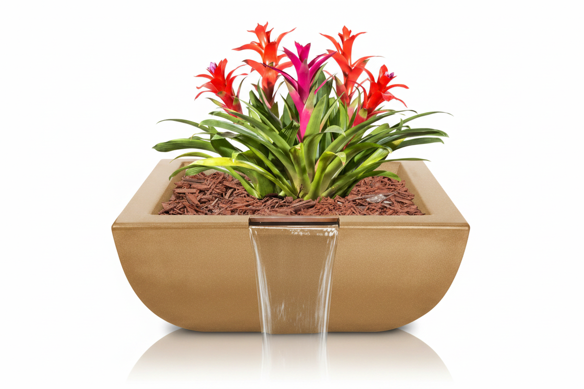 A modern rectangular concrete planter in a warm tan finish, featuring a front waterfall spout with clear water flowing into a clear glass bowl. The planter is filled with brown coir bark and hosts a vibrant green, red, and pink bromeliad plant, all set against a seamless white background.