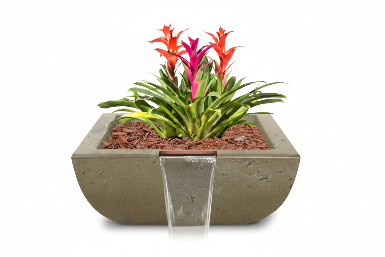 A rectangular concrete planter with a front waterfall feature, filled with green foliage, red and pink flowers, and brown mulch, shown on a white background.