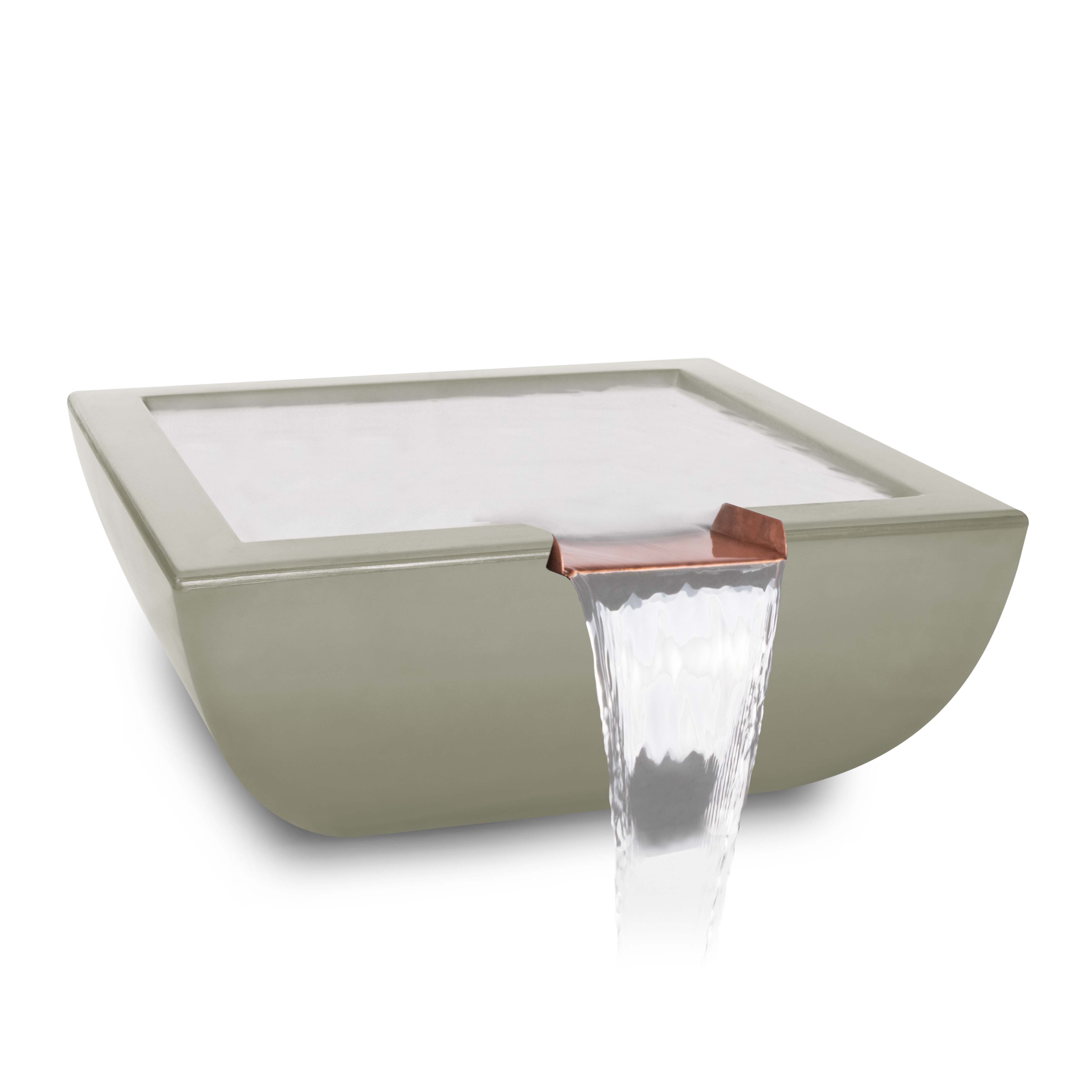 Modern outdoor water feature with glass top and copper faucet on a white background