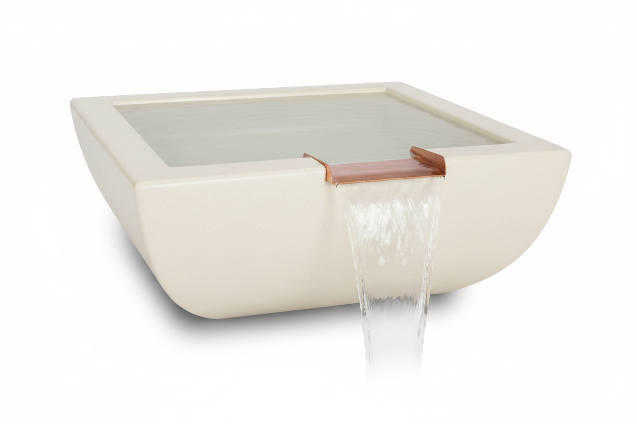 A square ceramic wall-mounted basin with a waterfall spout, shown with water flowing out. The basin is a warm cream color with a copper-toned metal spout, set against a plain white background.