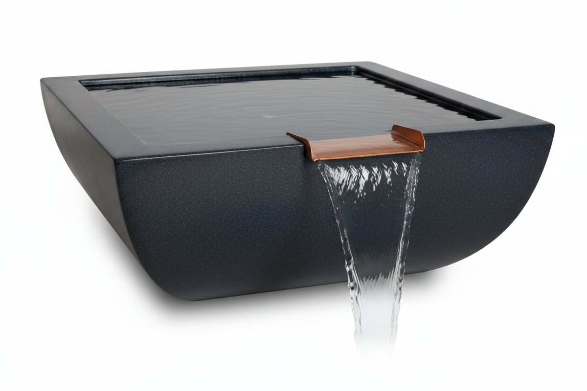 A modern rectangular solar-powered waterfall fountain in a matte black finish, featuring a copper-colored metal spout with water flowing down, shown on a white background.