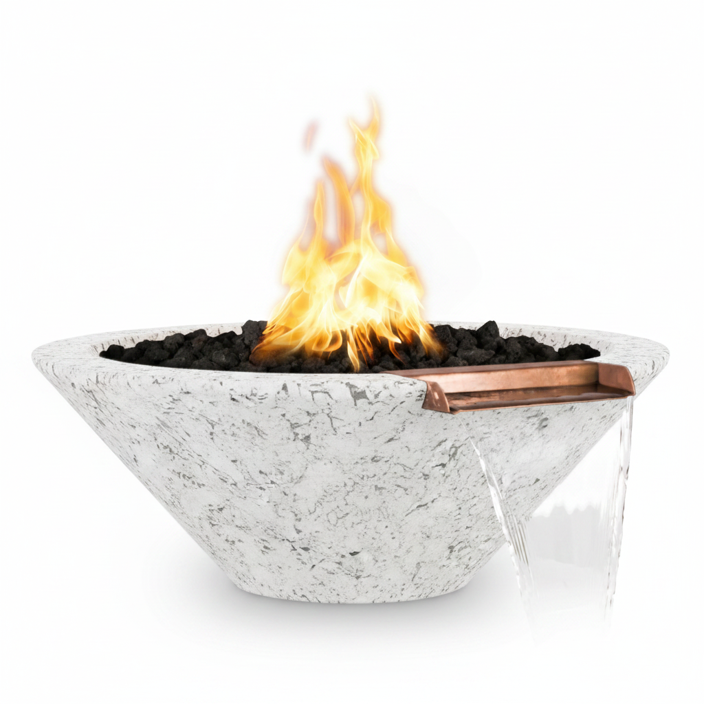 A modern outdoor fire pit bowl made of textured light gray stone, filled with black fire rocks and a bright orange flame. A copper-colored metal drip tray holds the dripping water, which cascades down onto a clear glass wind guard.