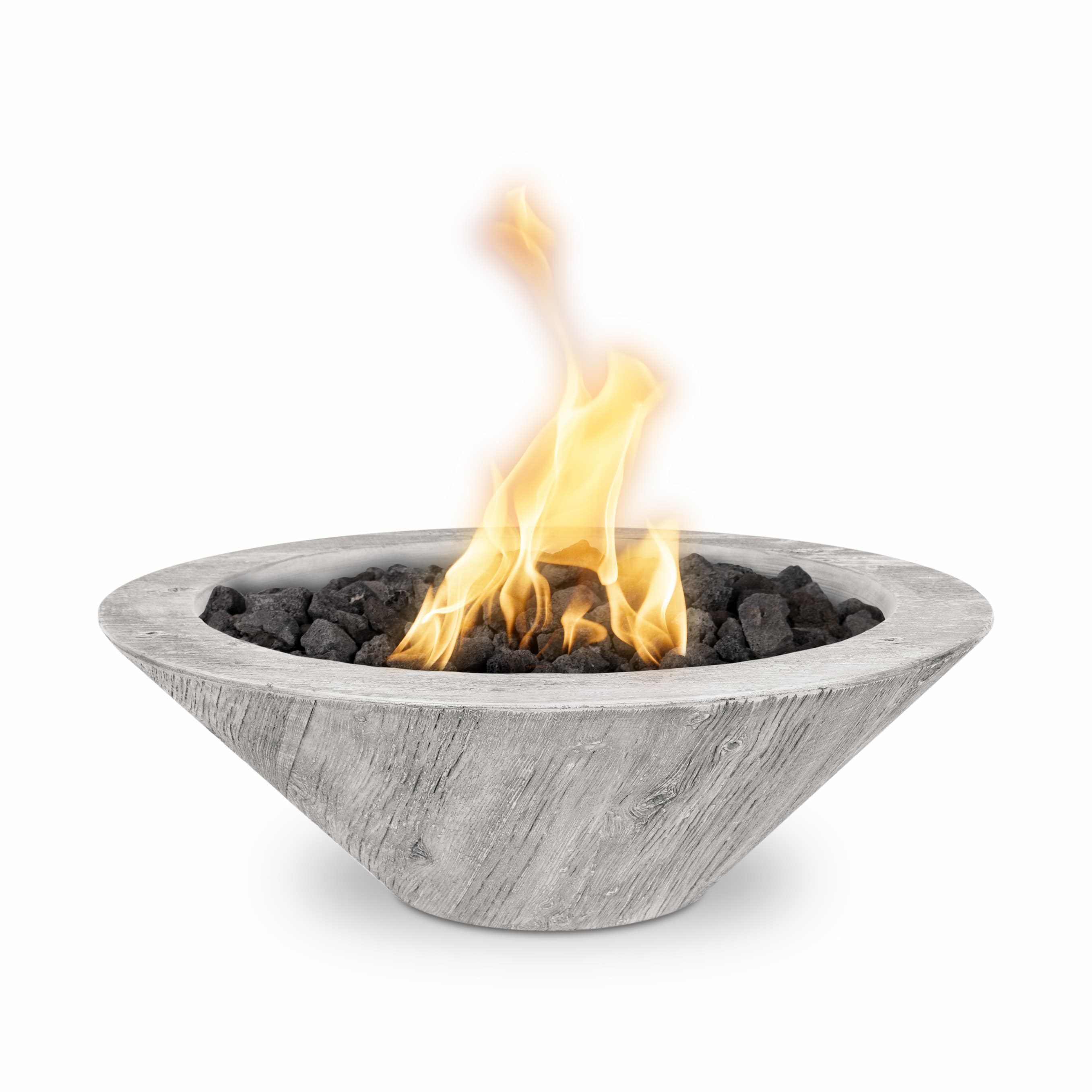 A modern concrete fire pit bowl with a gray wood-grain finish, filled with black lava rocks and lit with a bright orange and yellow flame, isolated on a white background.