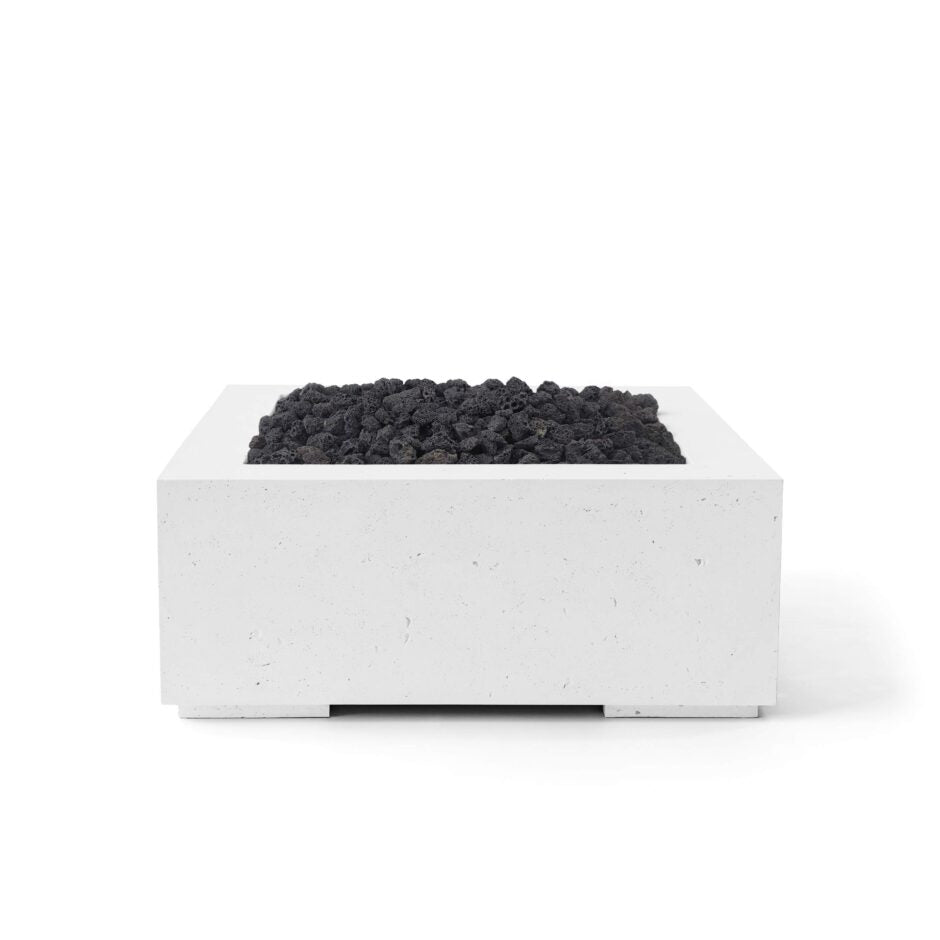 Concrete fire pit with black coals on a white background