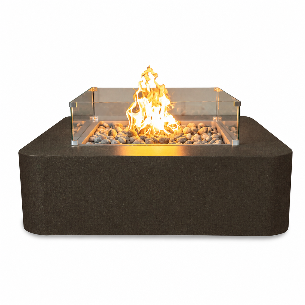 A rectangular outdoor fire pit with a matte dark charcoal base, clear acrylic sides, and active orange flames over gray stones, shown on a plain white background.