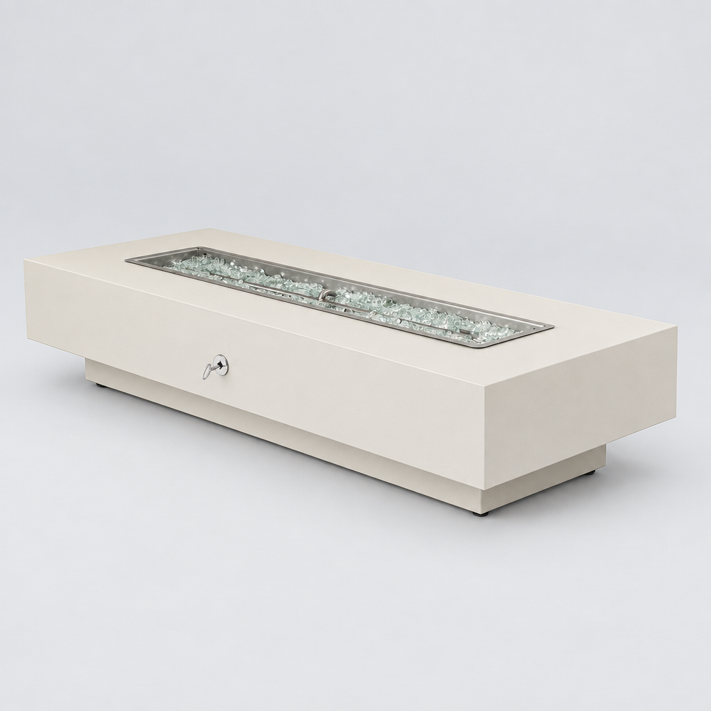 A modern rectangular fire pit table in a warm cream finish, featuring a recessed stainless steel firebox filled with clear glass chips, shown on a light gray studio background.