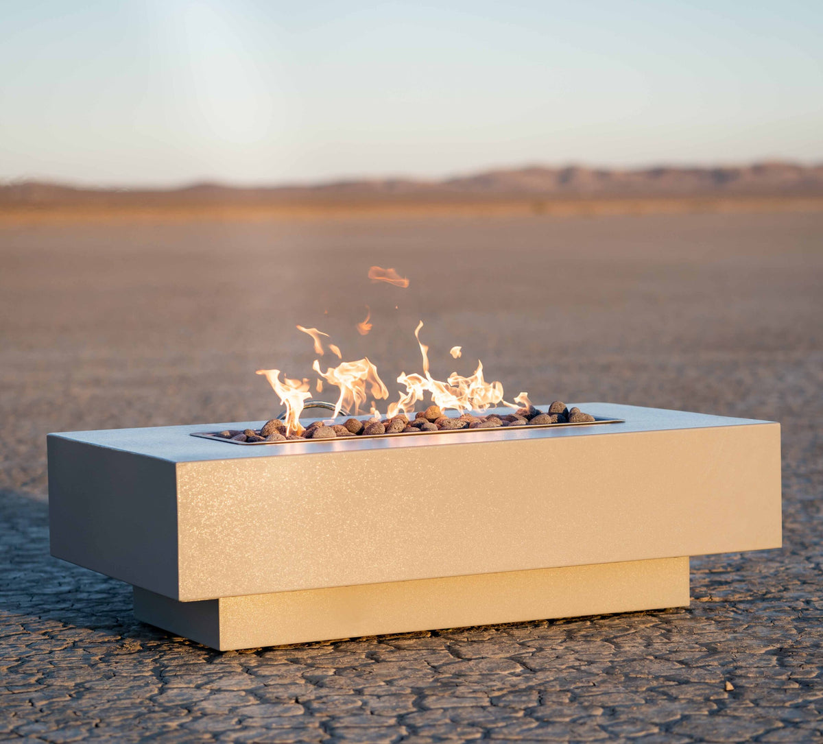 The Outdoor Plus Coronado linear fire pit in an outdoor setting