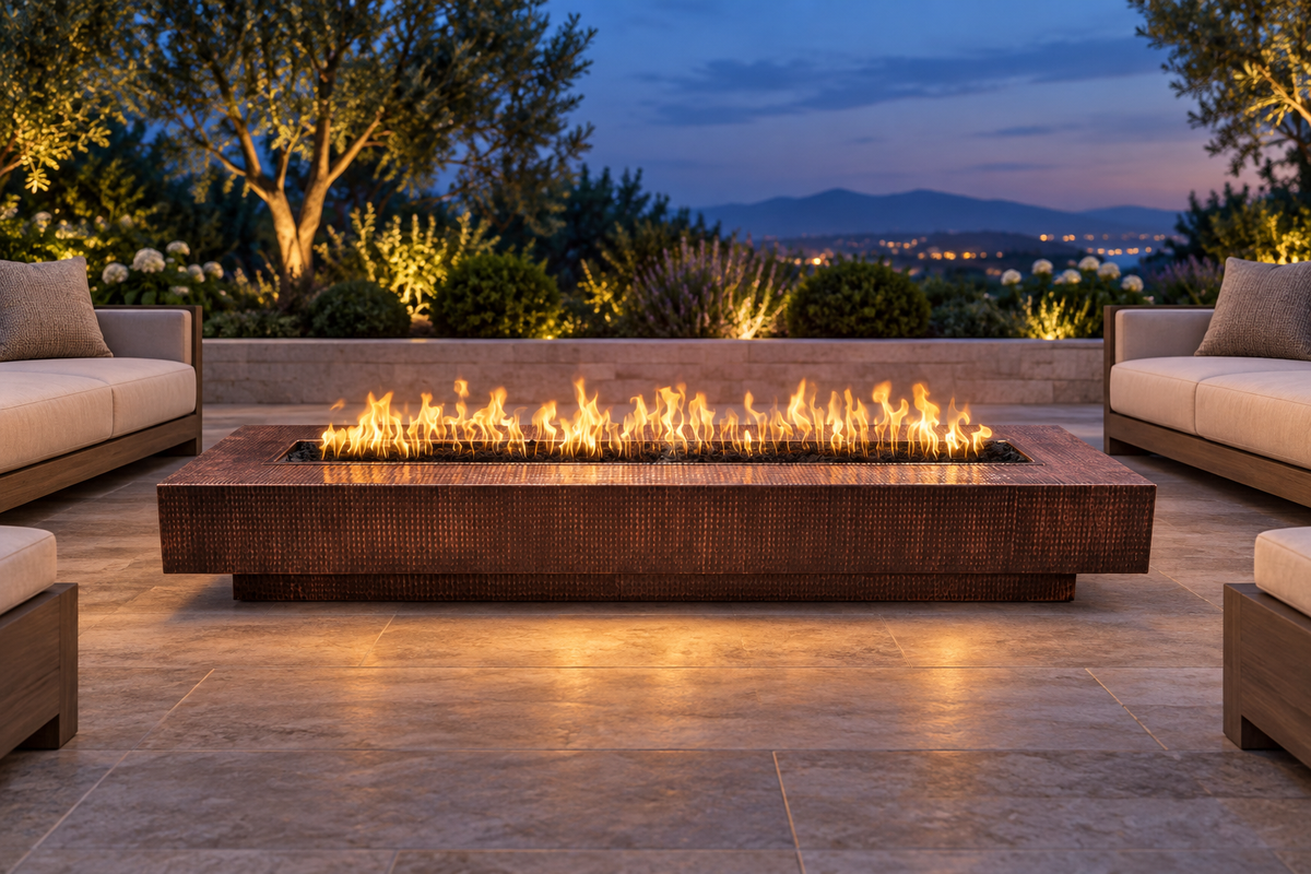 Hammered-copper Coronado fire pit on an outdoor terrace