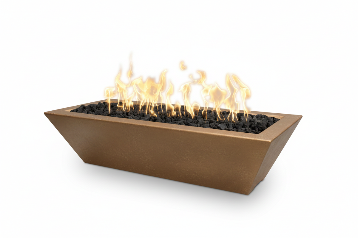 A rectangular bronze fire pit planter with black river rocks and active yellow-orange flames, shown on a clean white background.