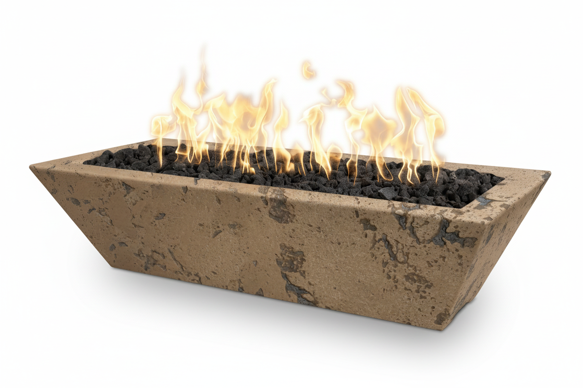 A rectangular concrete fire pit with a textured tan finish, filled with black lava rocks and active yellow-orange flames, shown on a clean white background.