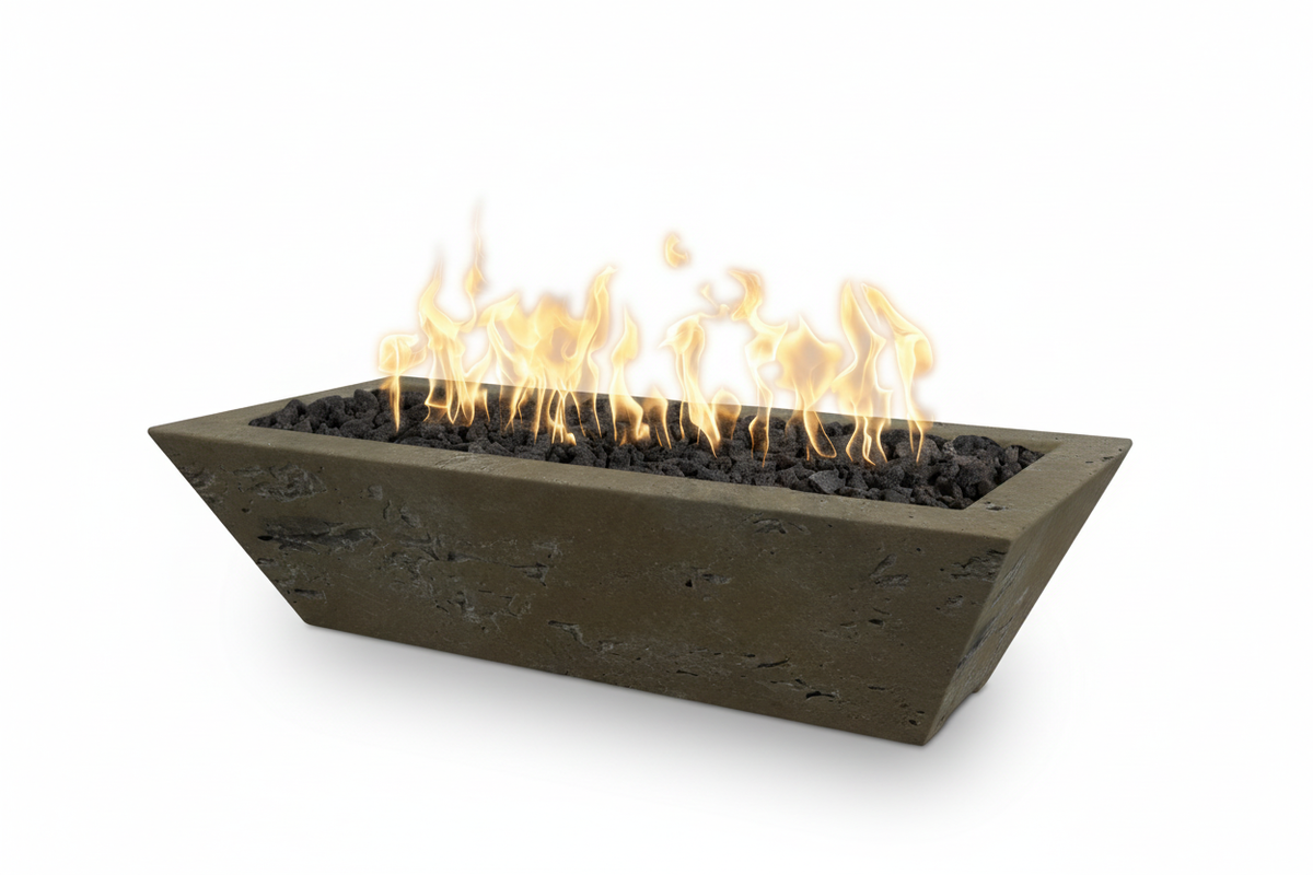 A rectangular concrete fire pit with a tapered triangular design, filled with dark gravel and active orange and yellow flames, shown on a solid white background.