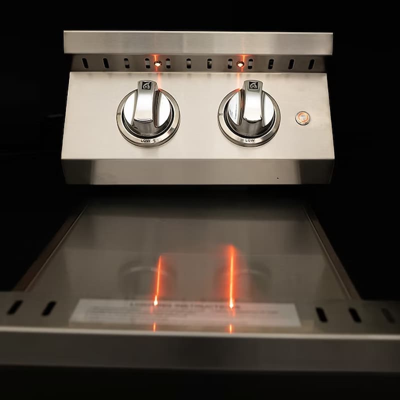 Stainless steel gas stove with two knobs on a black background
