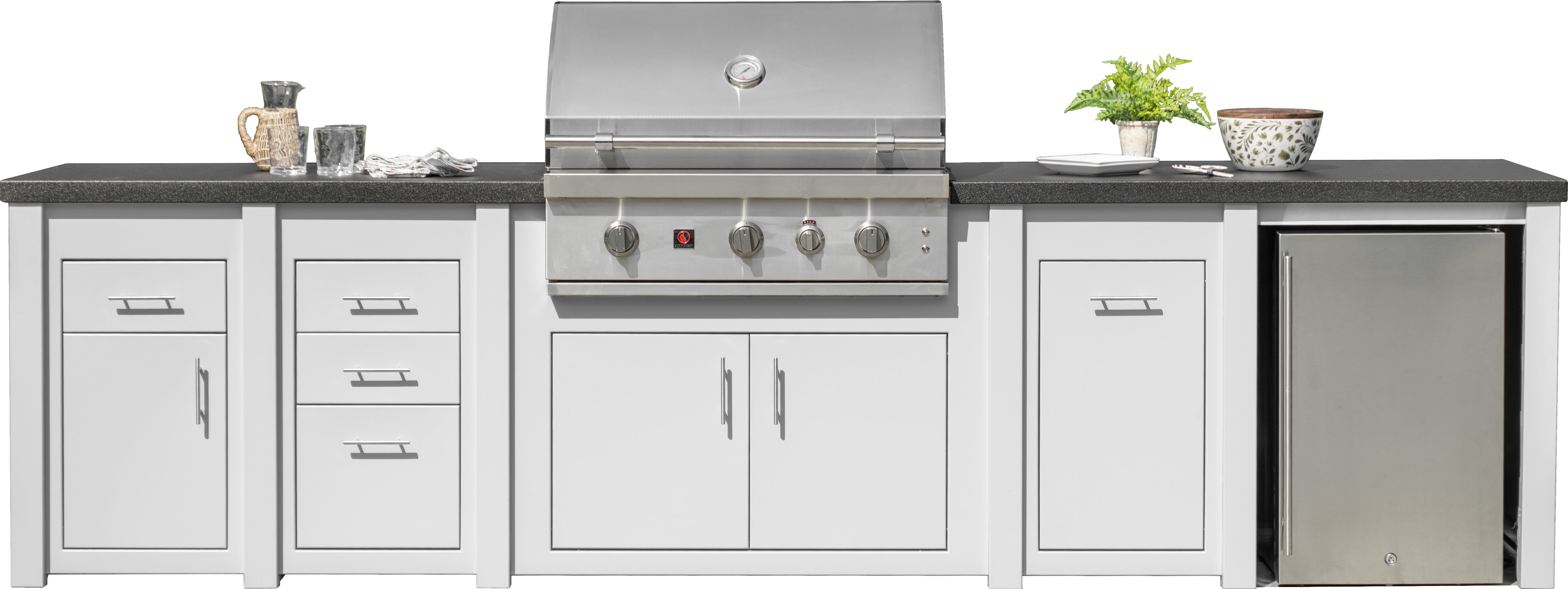 Outdoor kitchen island set with white cabinets, dark countertops, a stainless steel gas grill, a small stainless steel refrigerator, and a potted plant on a white background.