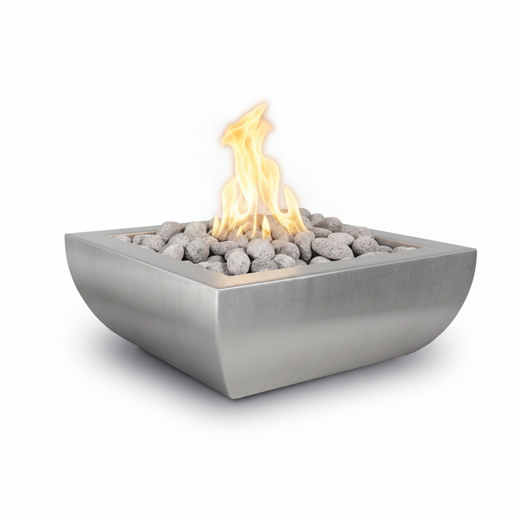 A square stainless steel outdoor fire pit with a brushed metal finish, filled with gray river stones and lit with a bright yellow-orange flame, shown on a solid white background.