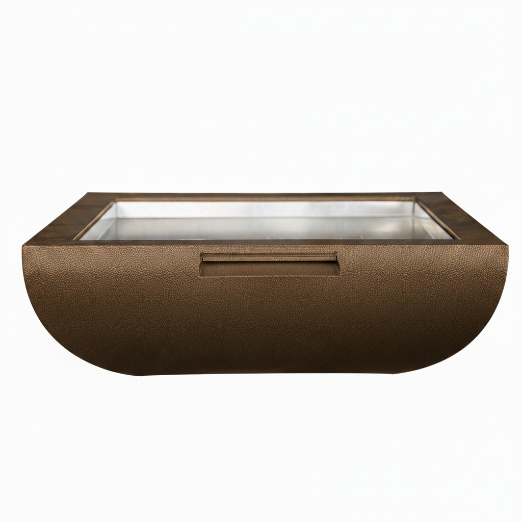 A rectangular outdoor fire pit with a textured bronze exterior, a glass wind guard, and a recessed handle on the front, shown against a plain white background.