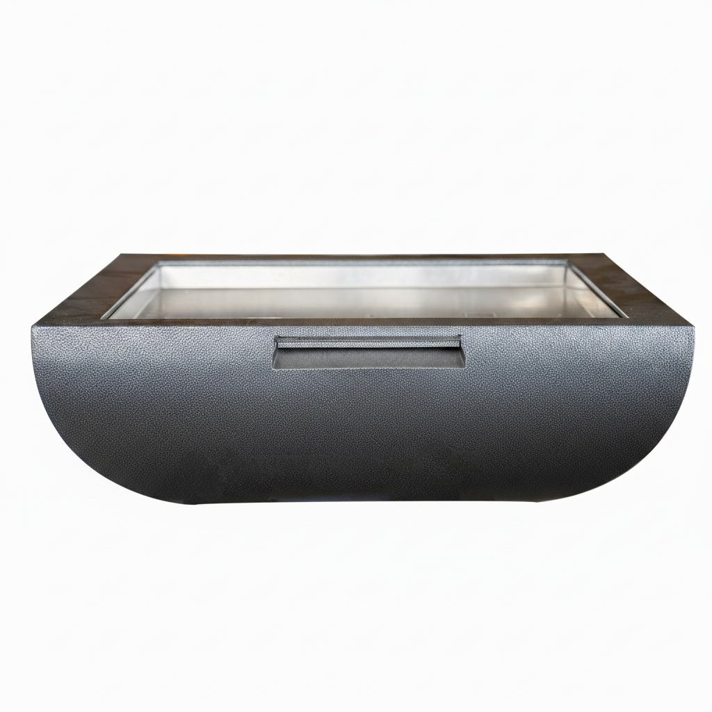 A modern rectangular outdoor fire pit with a textured dark gray exterior, a clear glass top, and a stainless steel interior, shown against a plain white background.