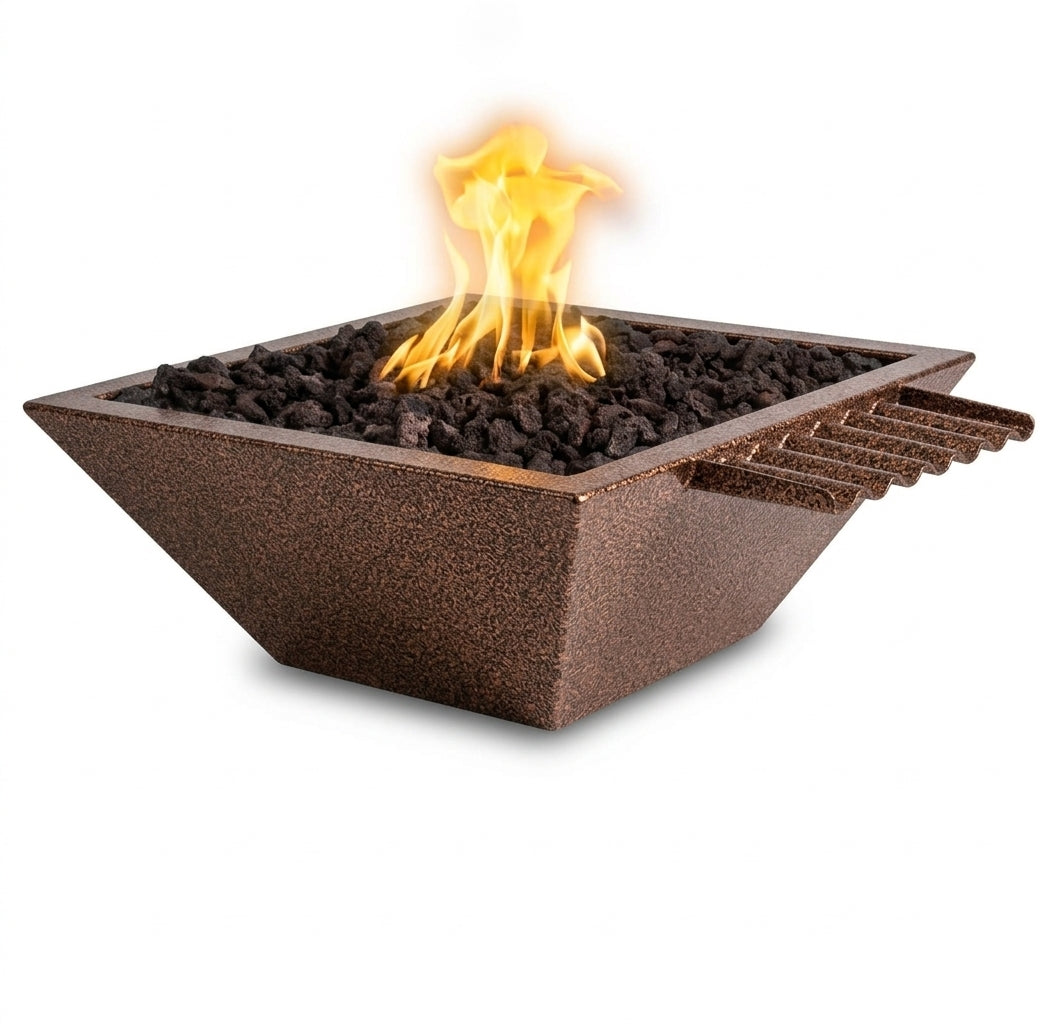 A square outdoor fire pit with a textured dark brown metallic finish, filled with black lava rocks and featuring a bright orange and yellow flame. The fire pit has a stepped side design and is shown on a solid white background.